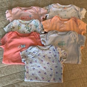 SOLD 7 Carter’s onesies